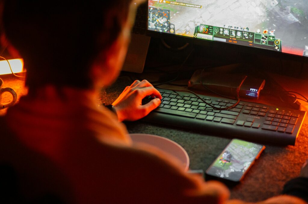A man playing a video game on his computer