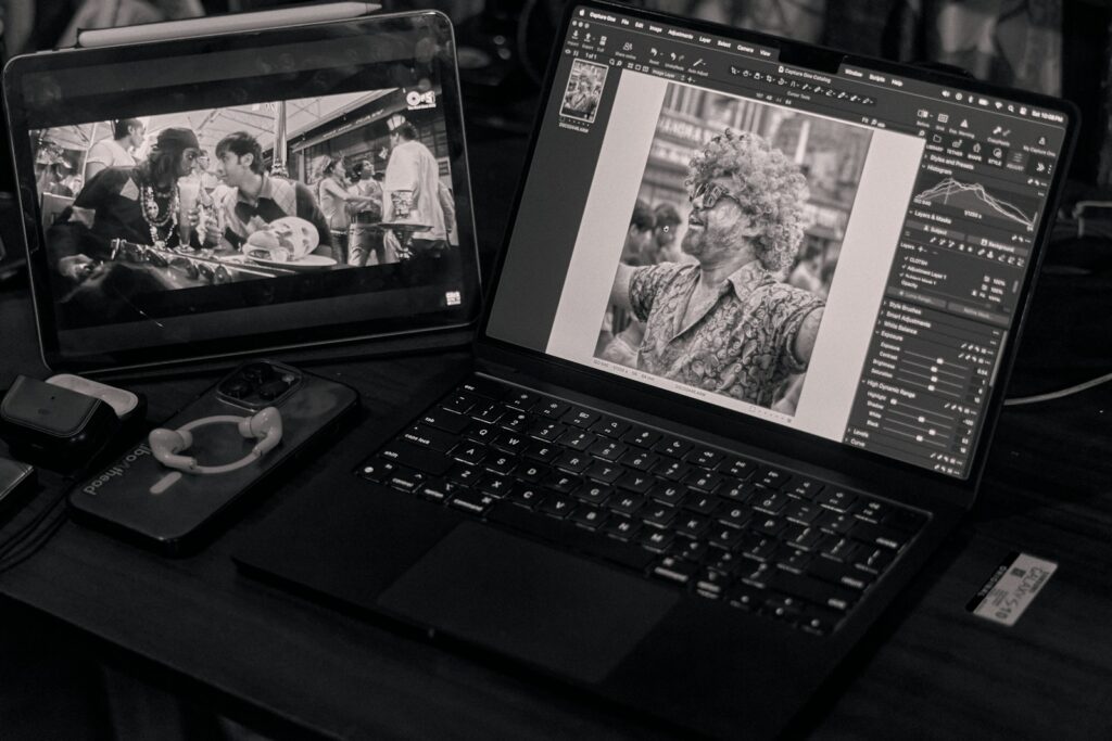 a laptop computer sitting on top of a wooden desk