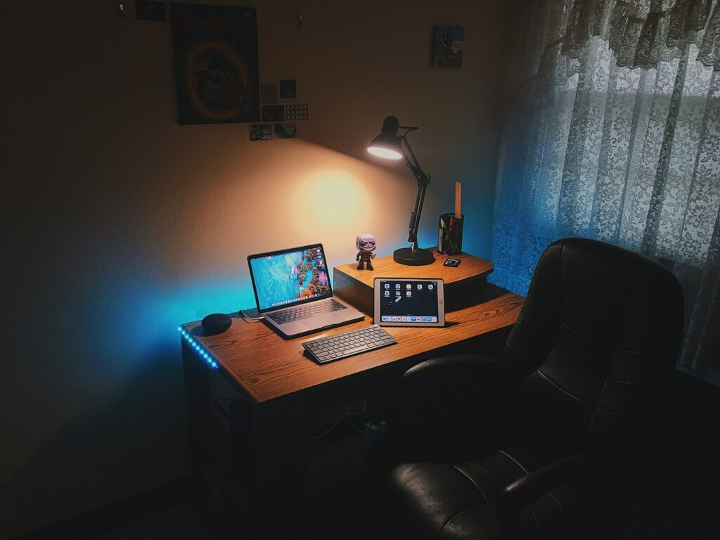 turned-on laptop computer on desk